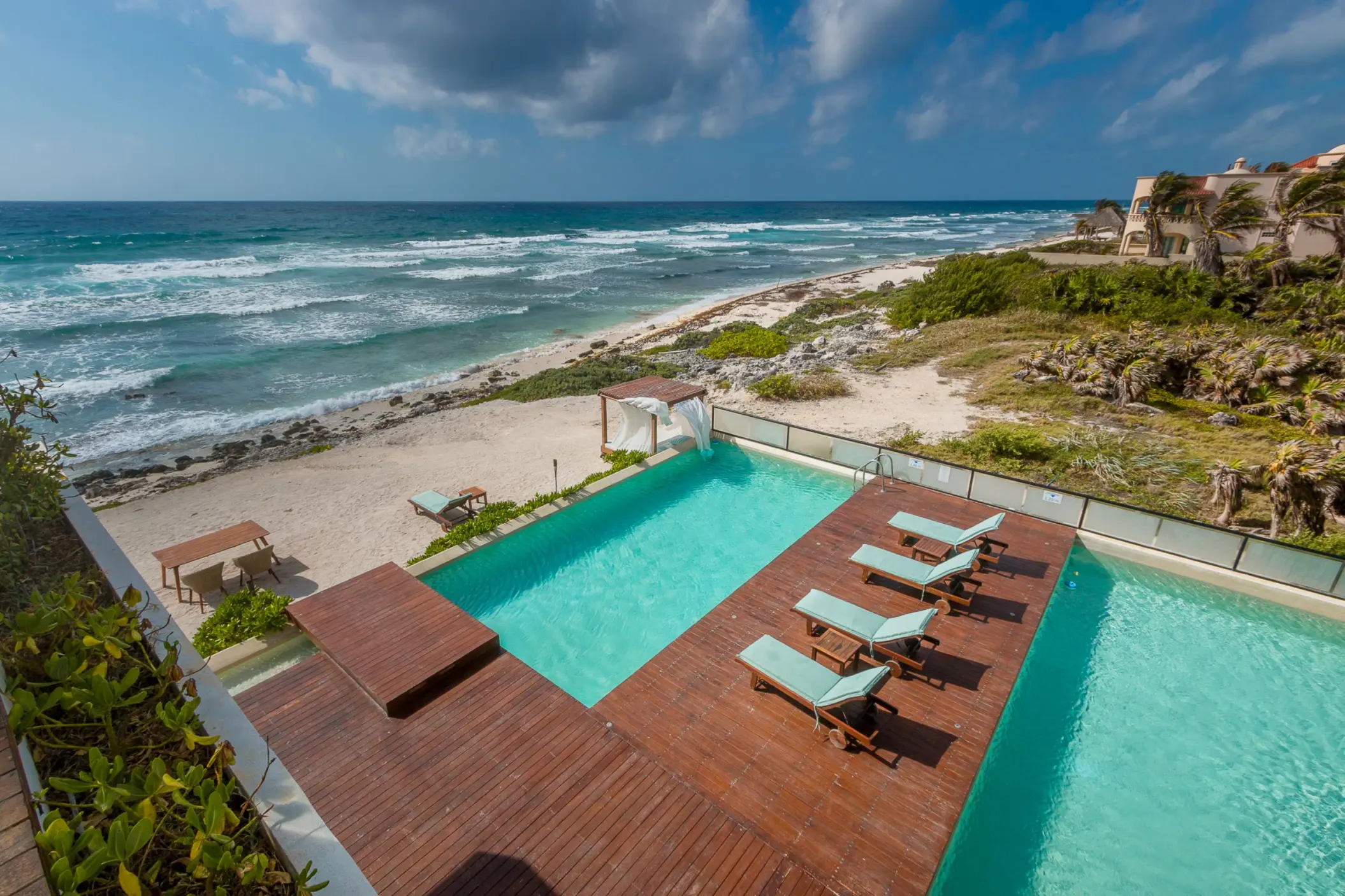 pool and pool deck with ocean views at O'Tulum Boutique Hotel