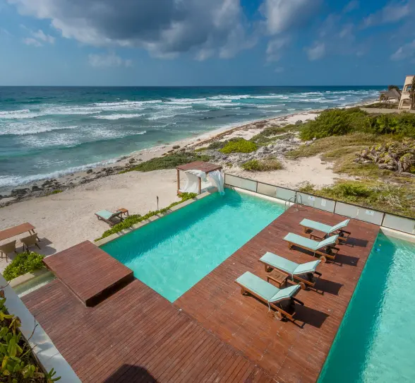 pool and pool deck with ocean views at O'Tulum Boutique Hotel