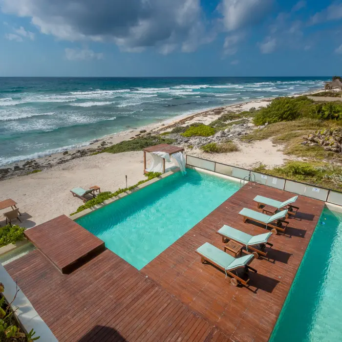 pool and pool deck with ocean views at O'Tulum Boutique Hotel