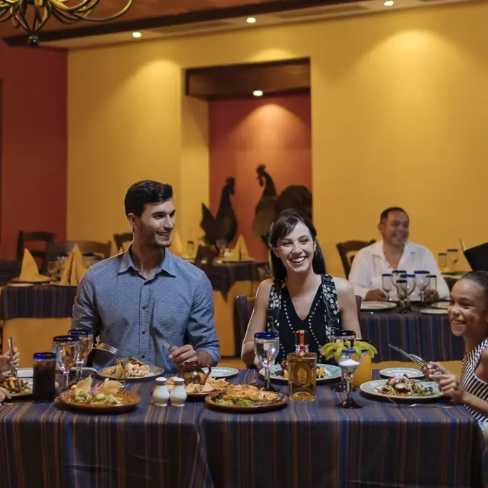 family at a restaurant at occidental at xcaret destination