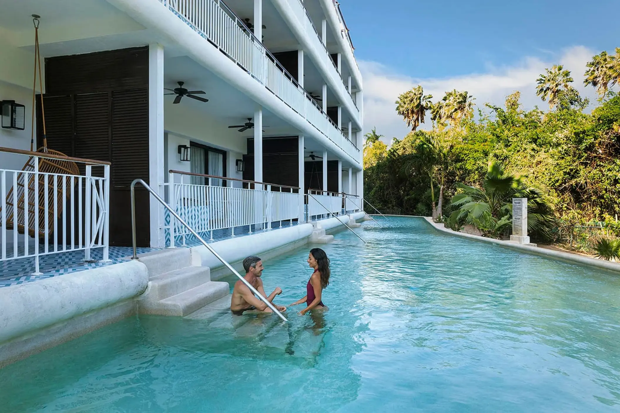 couple outside their swim out suite at Ocean Riviera Paradise