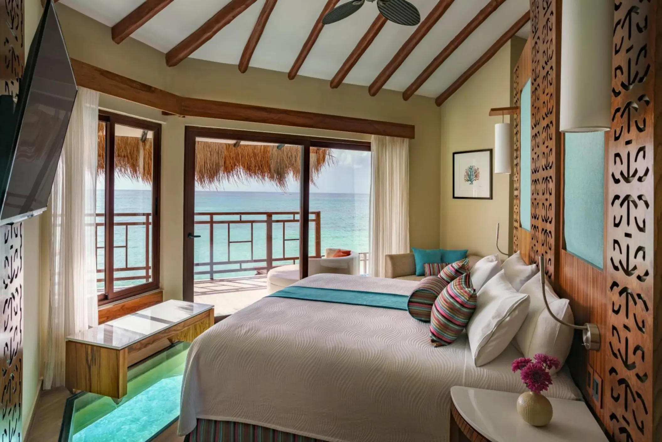 bed overlooking the sea at Palafitos Overwater Bungalows