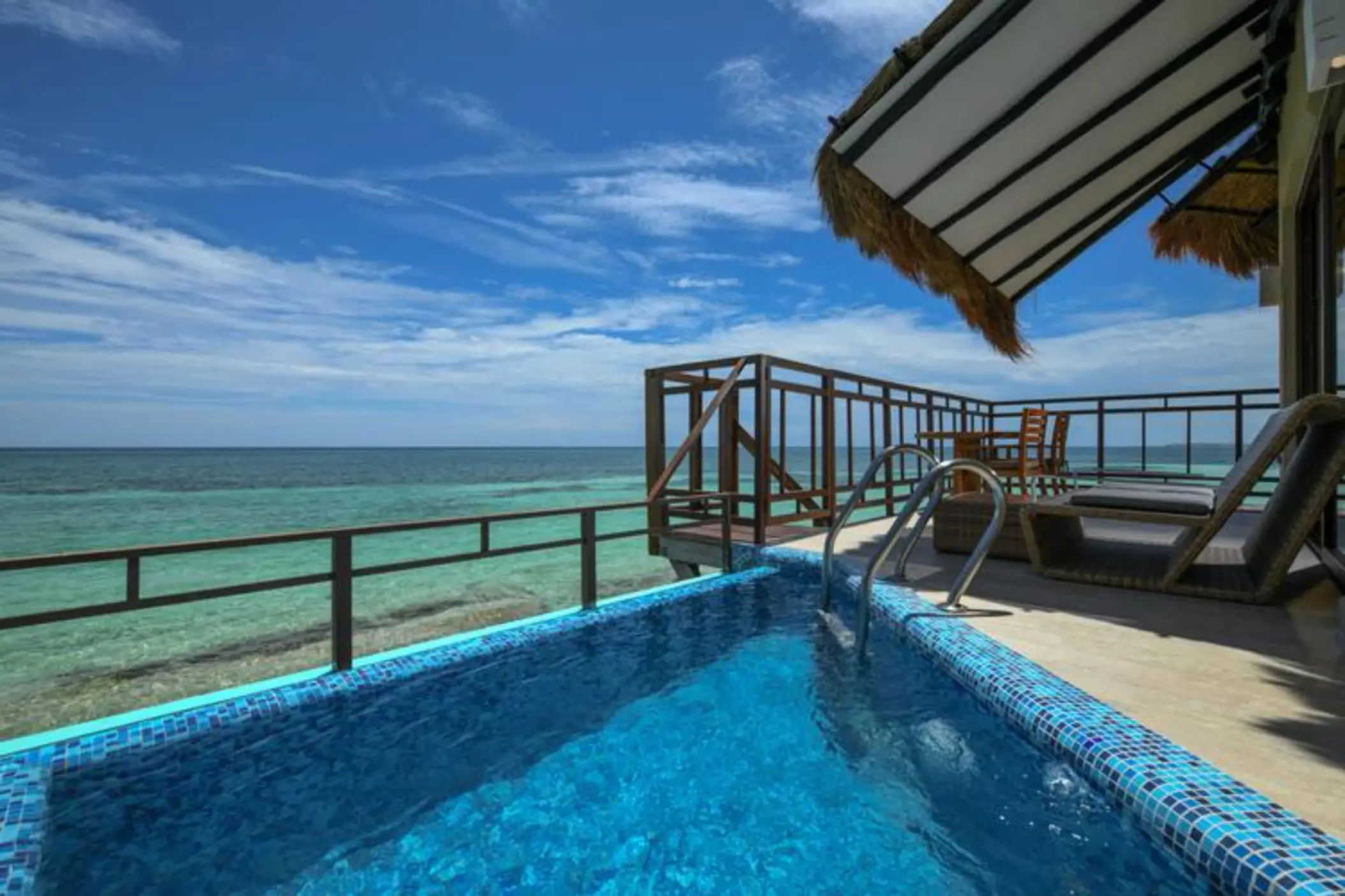 private pool of the Palafitos Overwater Bungalows with views of the sea