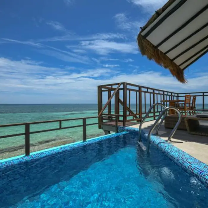 private pool of the Palafitos Overwater Bungalows with views of the sea