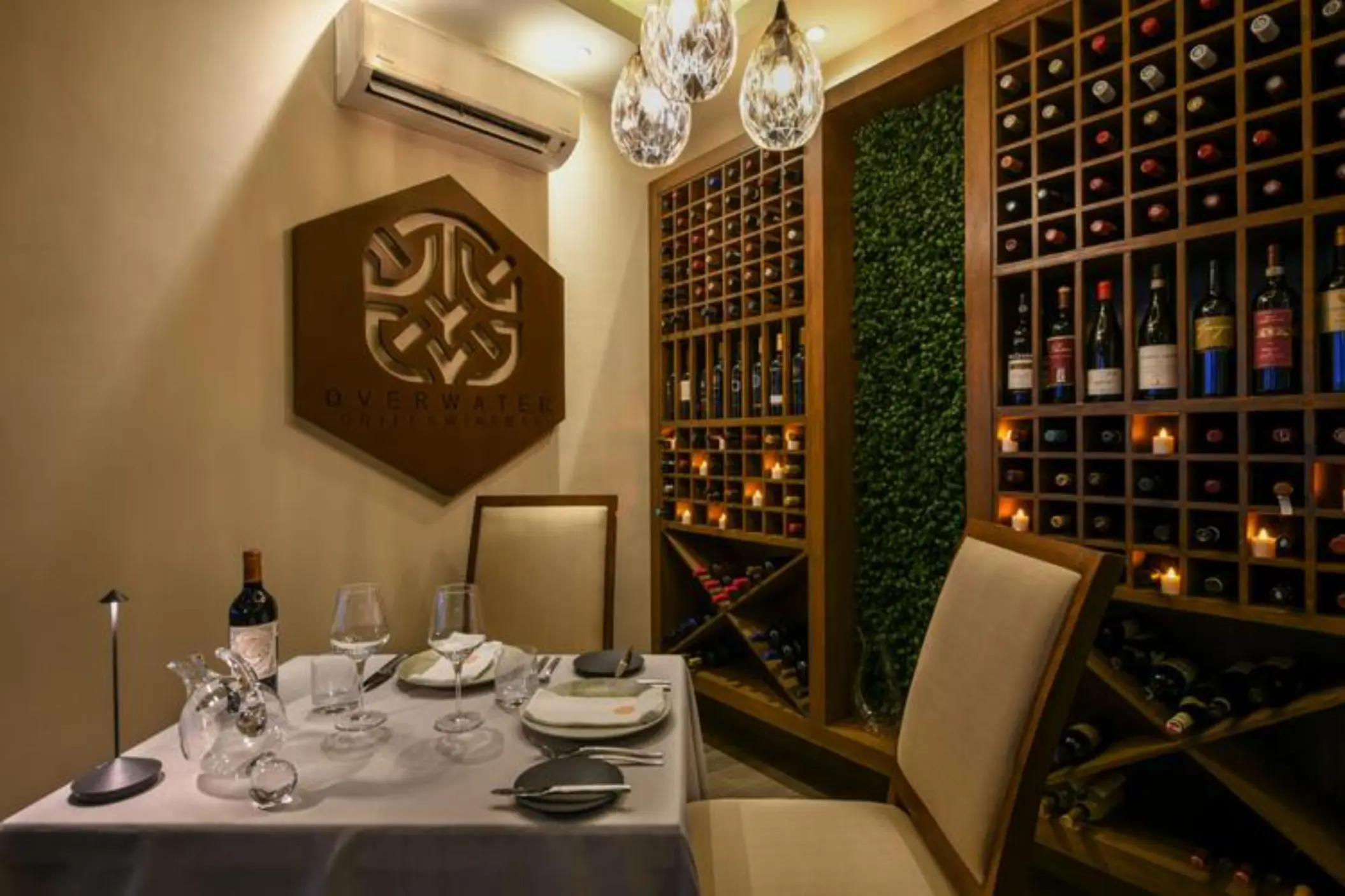 wine cellar at Palafitos Overwater Bungalows with a table laid out