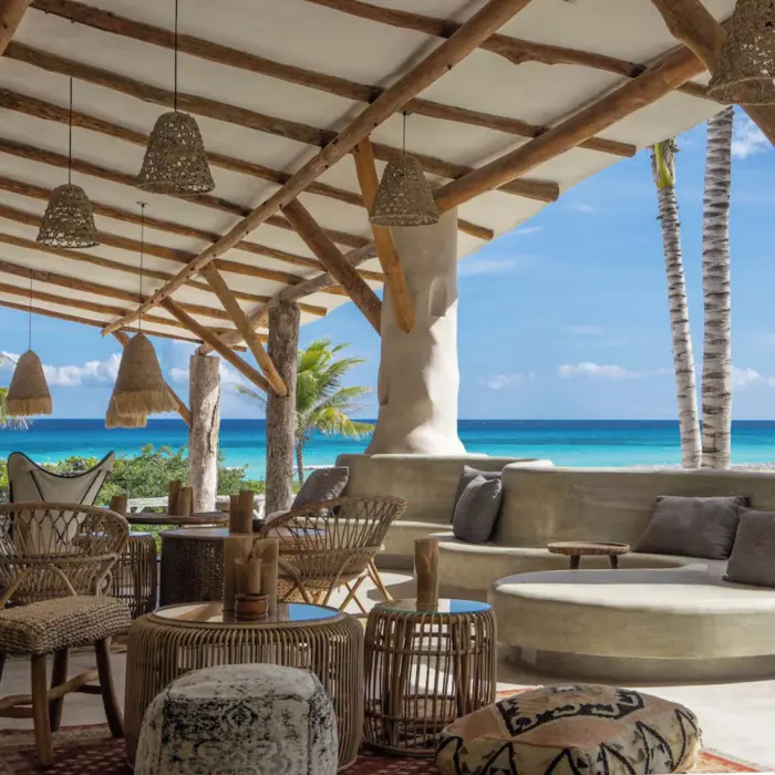 beach bar with chic seating at Palmaia House of AiA resort