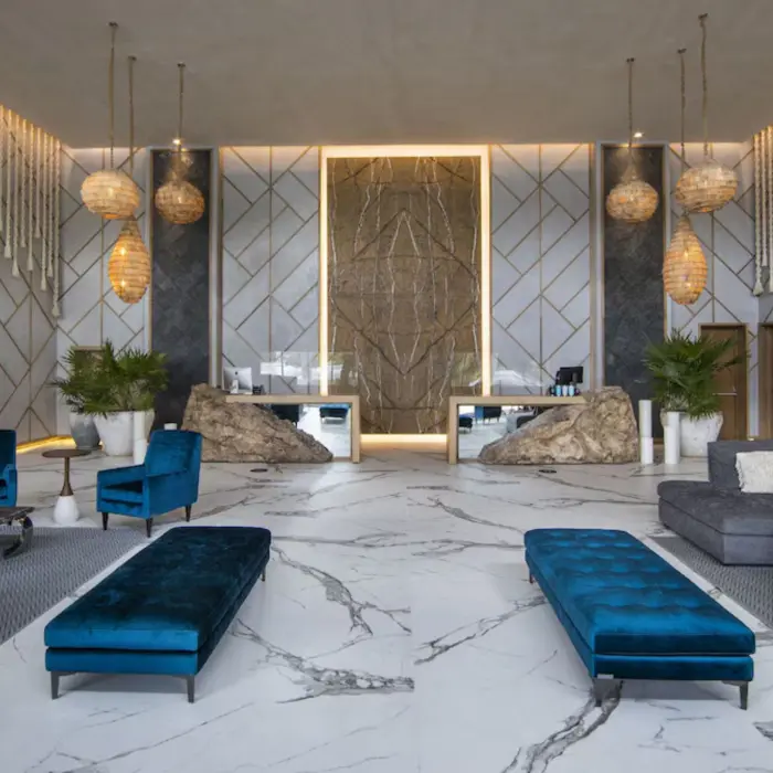 massive lobby with rustic decor at Palmaïa – The House of AïA