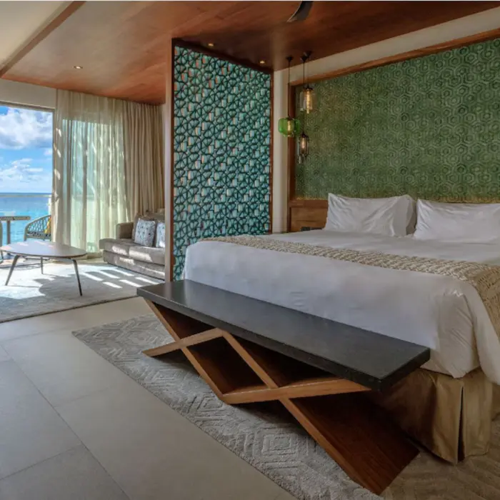 Spacious oceanview suite with contemporary decor and balcony at Palmaïa – The House of AïA