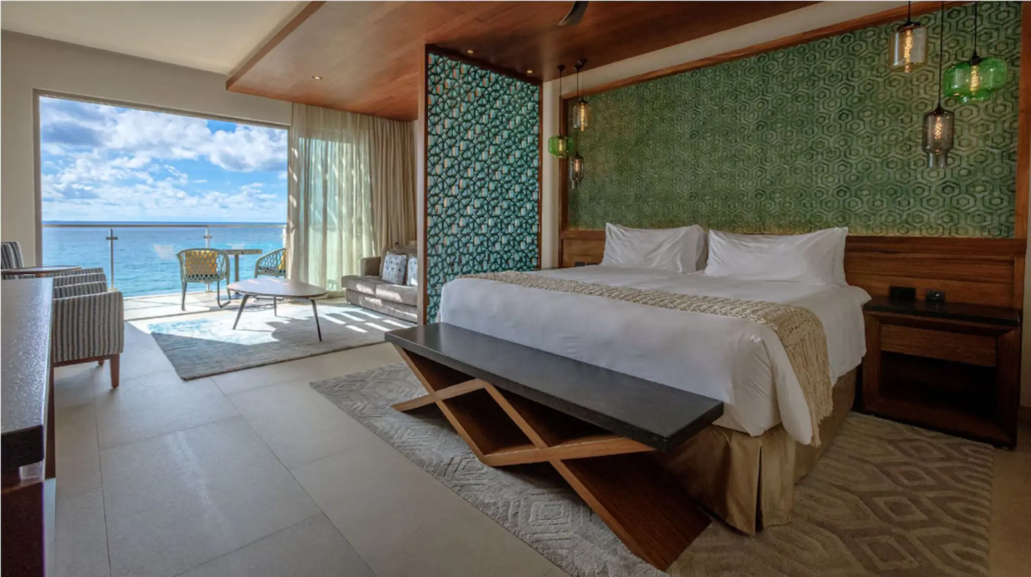 Spacious oceanview suite with contemporary decor and balcony at Palmaïa – The House of AïA