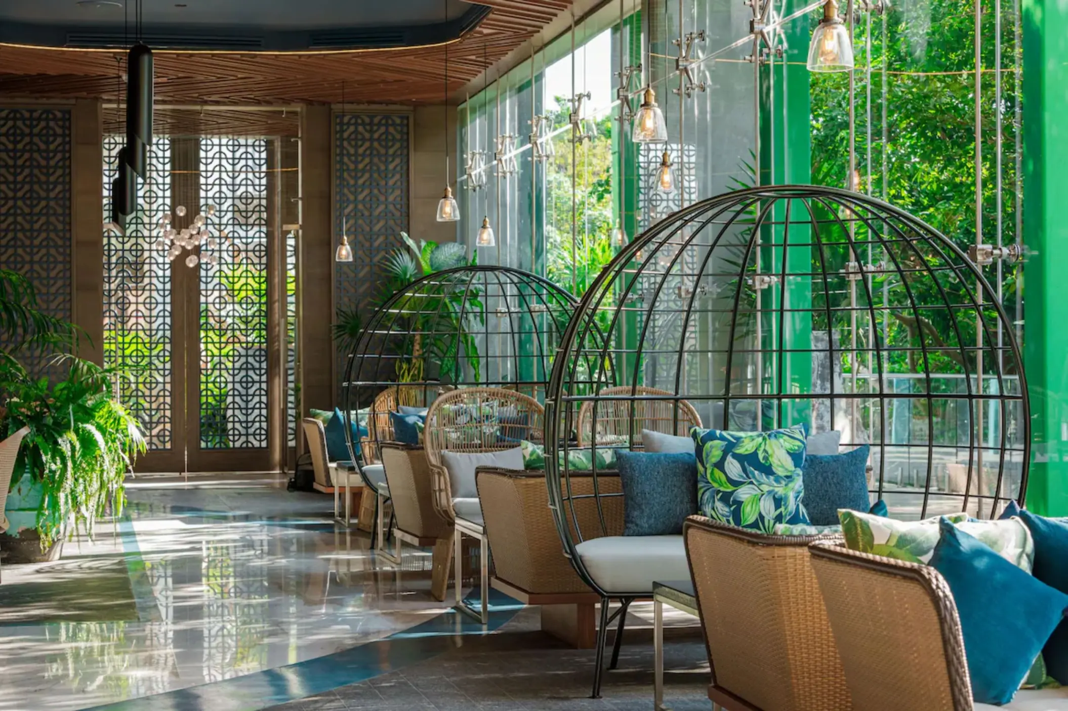 Elegant indoor restaurant with wood-accented interiors at Palmaïa – The House of AïA Riviera Maya