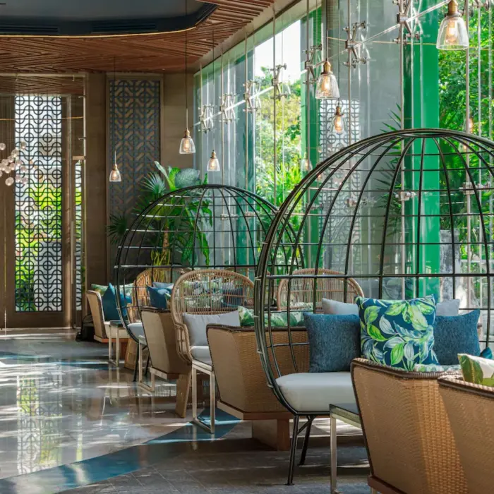 Elegant indoor restaurant with wood-accented interiors at Palmaïa – The House of AïA Riviera Maya