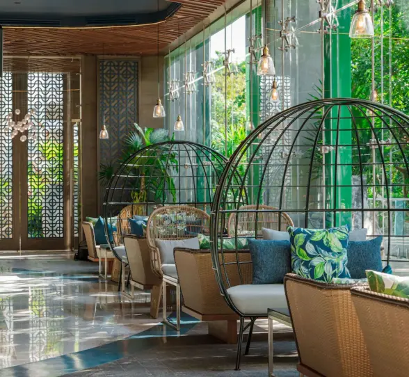 Elegant indoor restaurant with wood-accented interiors at Palmaïa – The House of AïA Riviera Maya