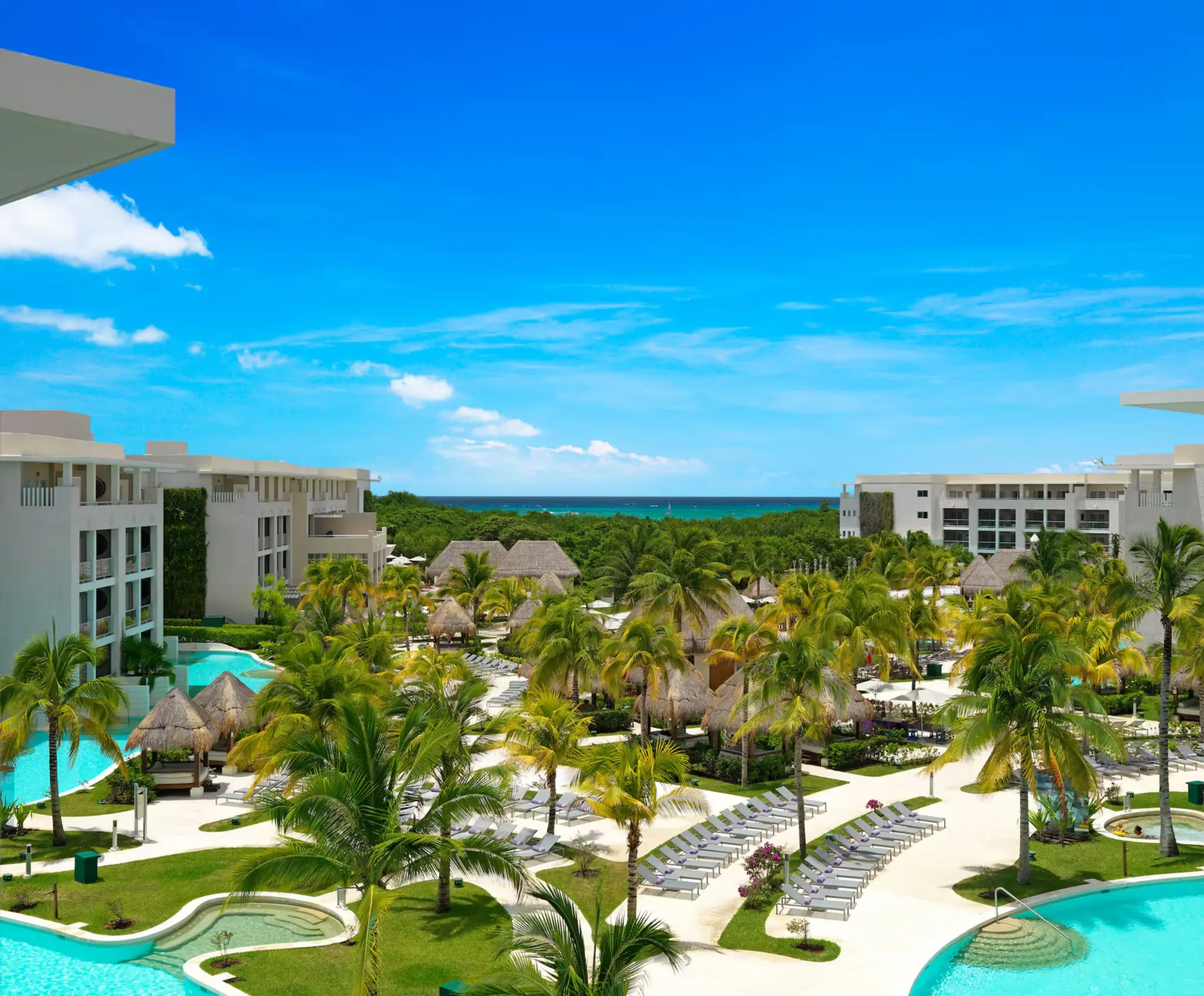 Paradisus Playa del Carmen resort buildings and pool and sea views
