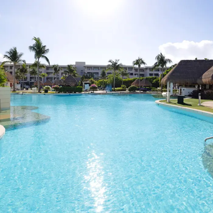 pool and palapas and resort buildings at Paradisus Playa del Carmen