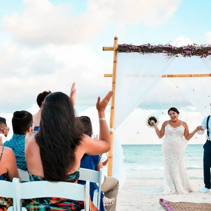 bride groom and guests during a beach ceremony at Playacar Palace