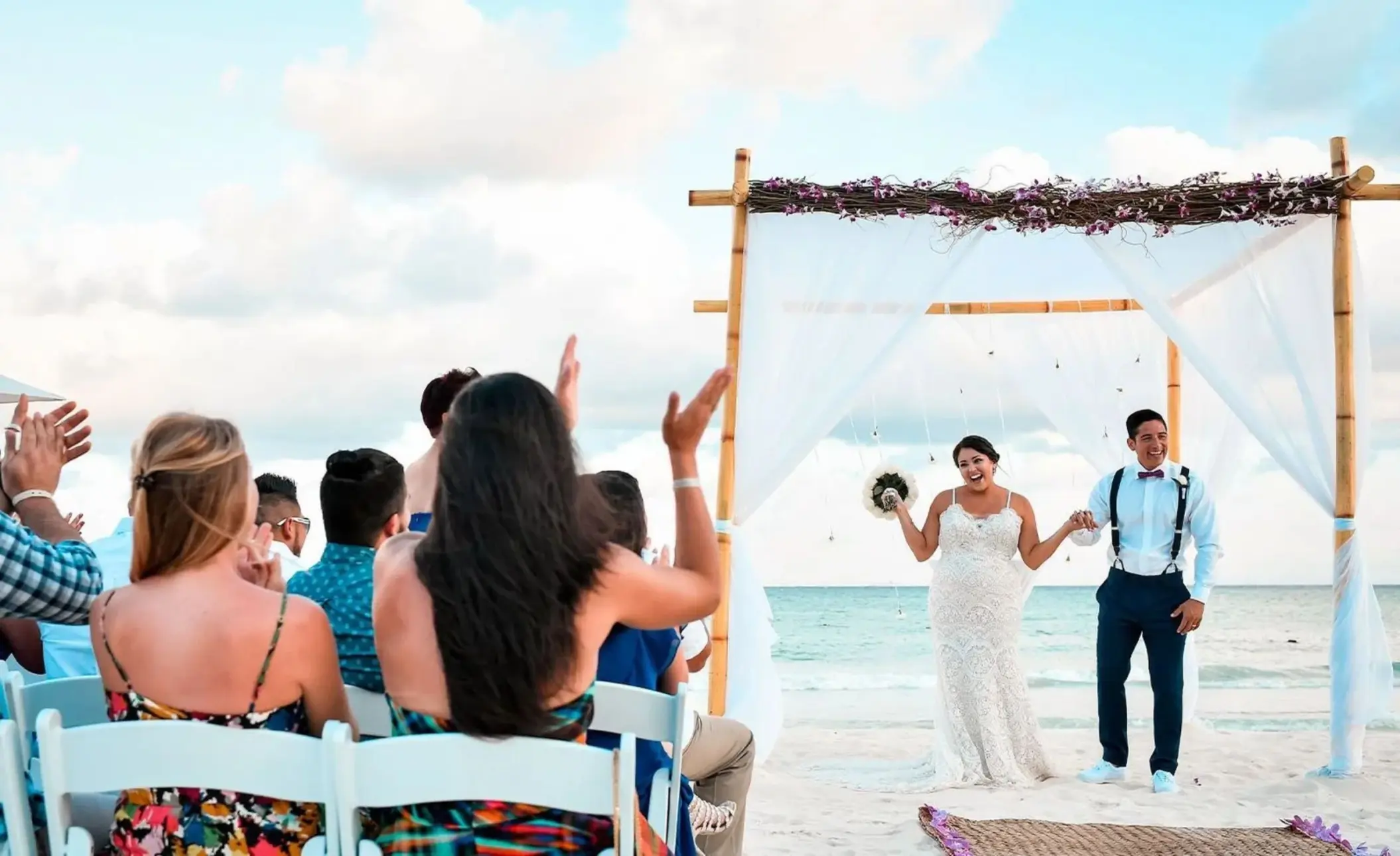 bride groom and guests during a beach ceremony at Playacar Palace