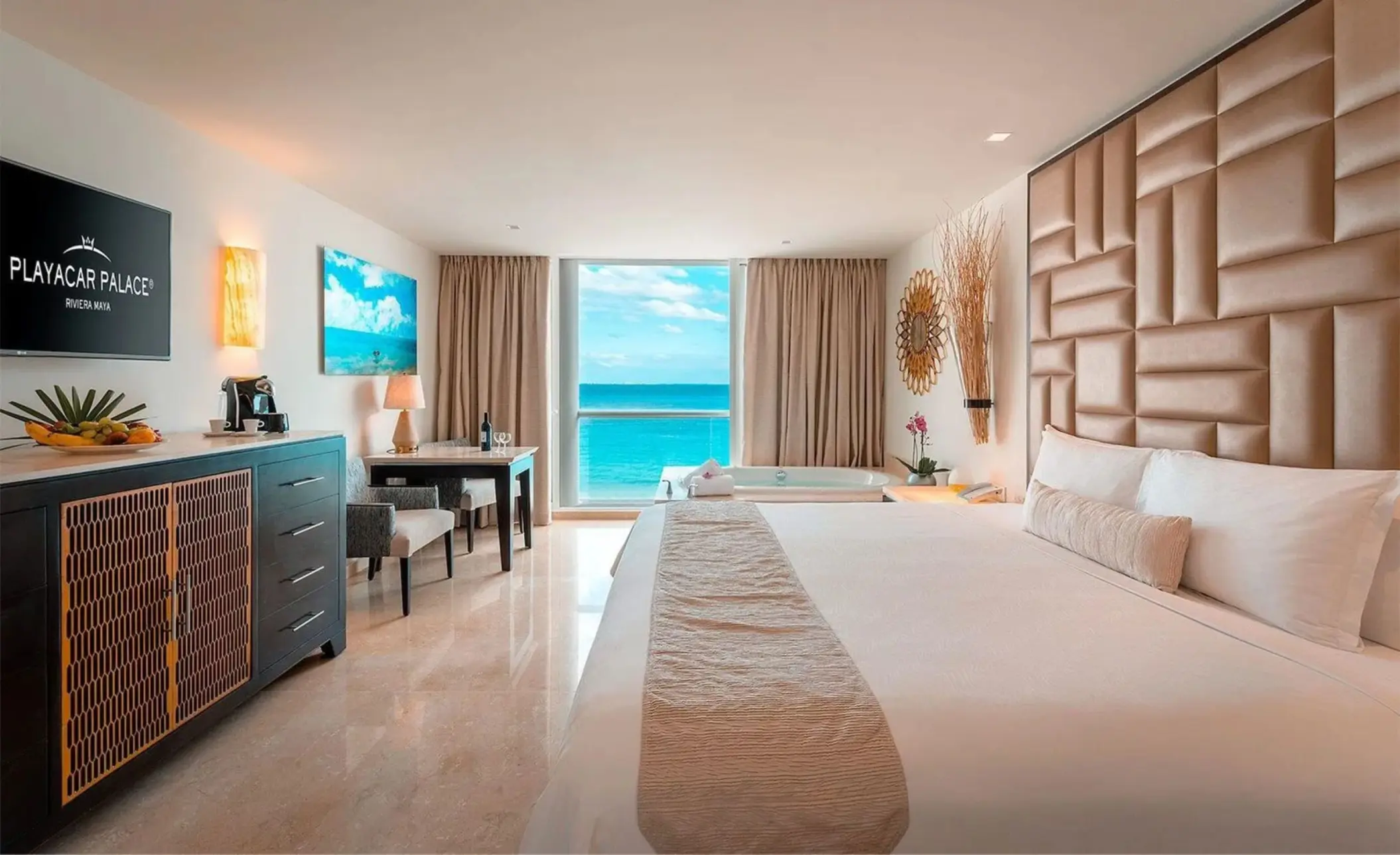 suite with hot tub and ocean views and king bed at Playacar Palace