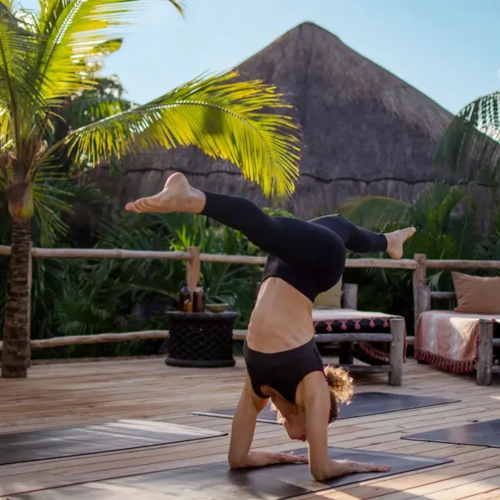 lady doing yoga at Radhoo Tulum