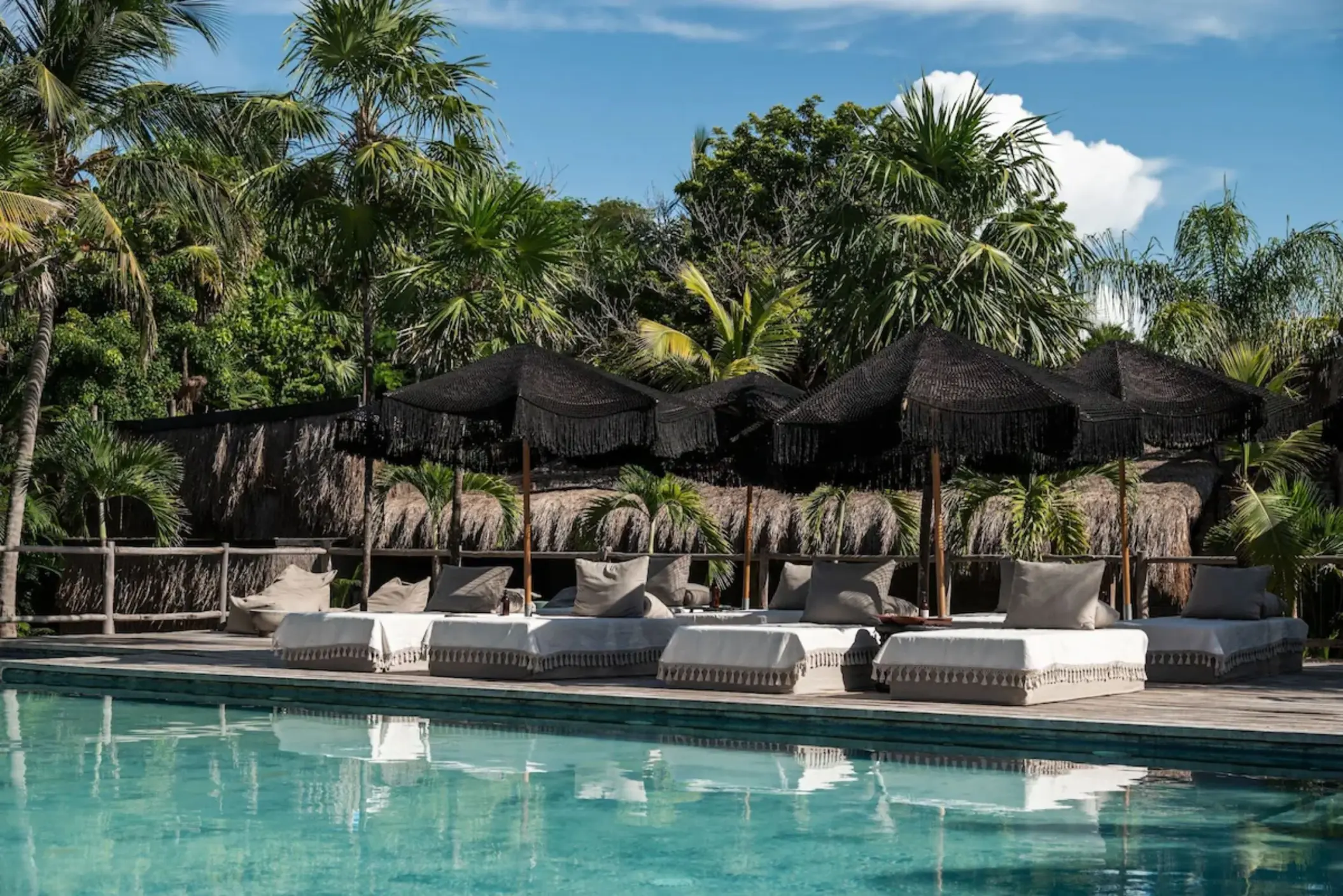 pool and loungers at Radhoo Tulum