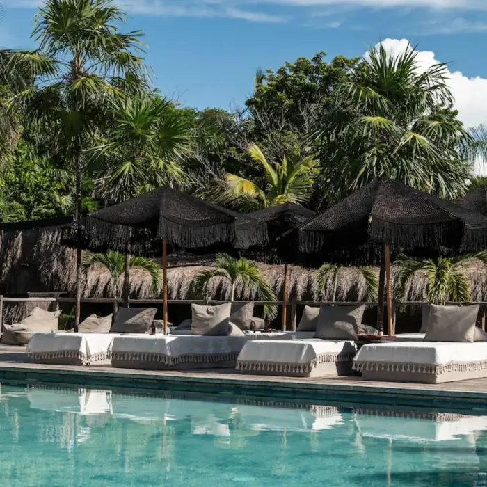 pool and loungers at Radhoo Tulum