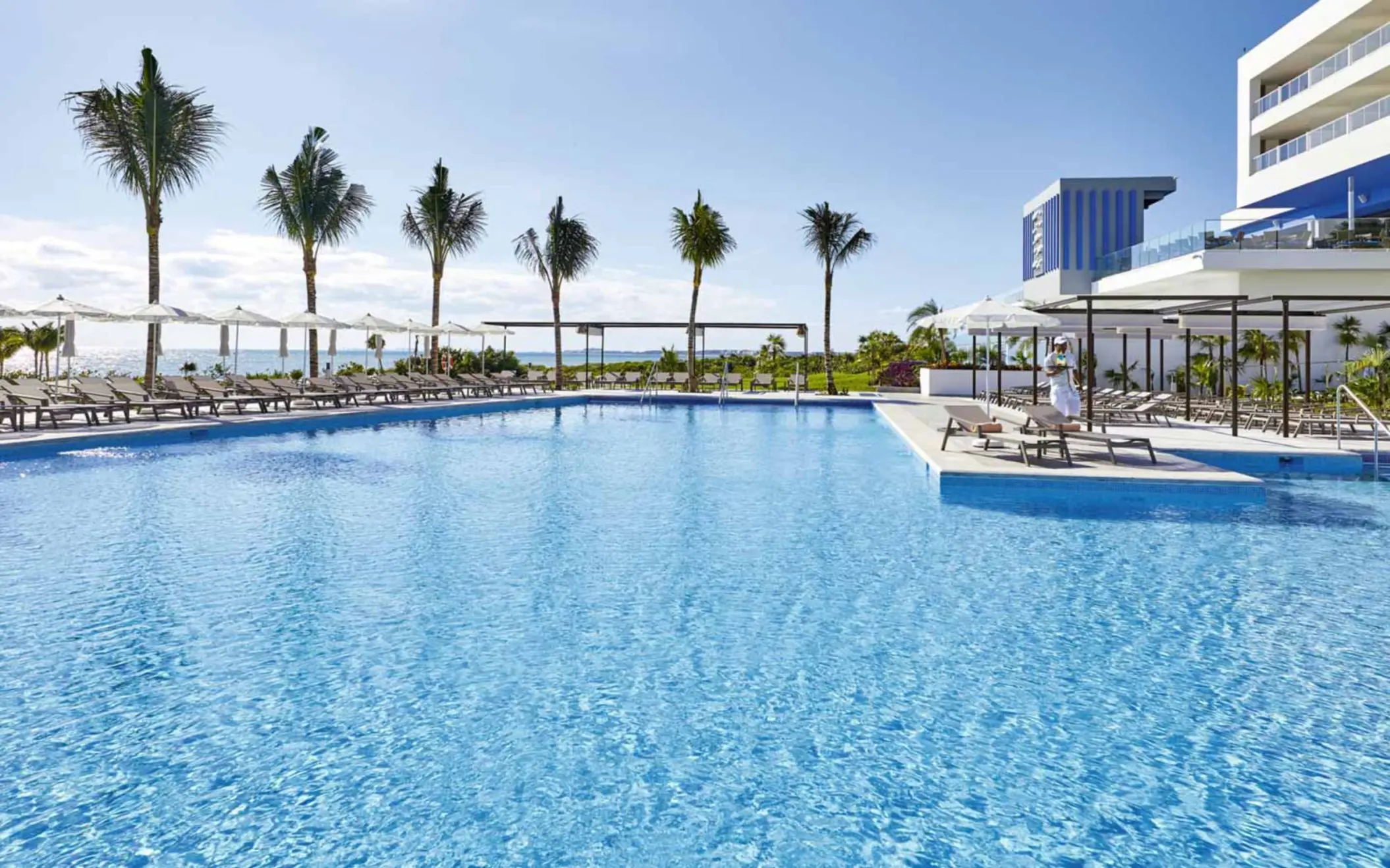 pool and loungers at Hotel Riu Palace Costa Mujeres