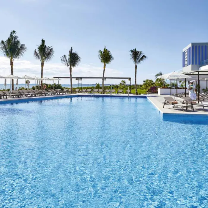 pool and loungers at Hotel Riu Palace Costa Mujeres