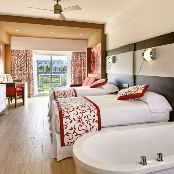 suite with two beds at Hotel Riu Palace Costa Mujeres