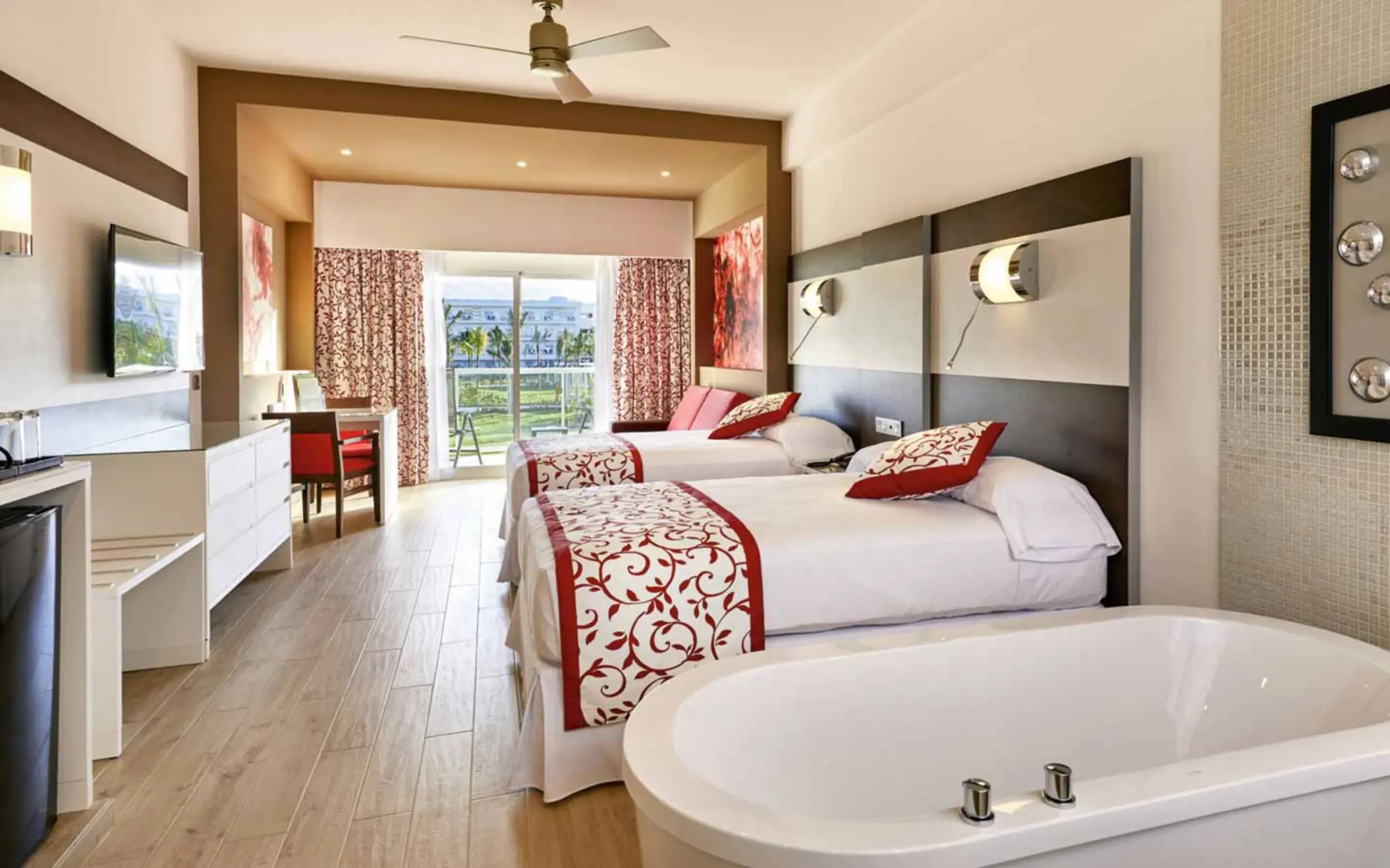 suite with two beds at Hotel Riu Palace Costa Mujeres