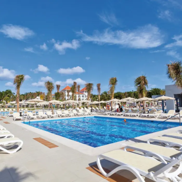 pool and loungers at Hotel Riu Palace Mexico