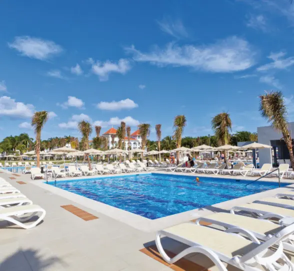 pool and loungers at Hotel Riu Palace Mexico