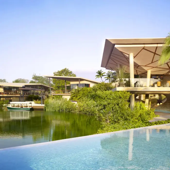 Lagoon and resort lobby view from bridge at Rosewood Mayakoba