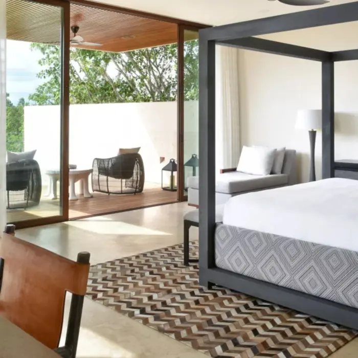 Manglar Three-Bedroom Villa at Rosewood Mayakoba with a private pool, lush greenery, and contemporary decor