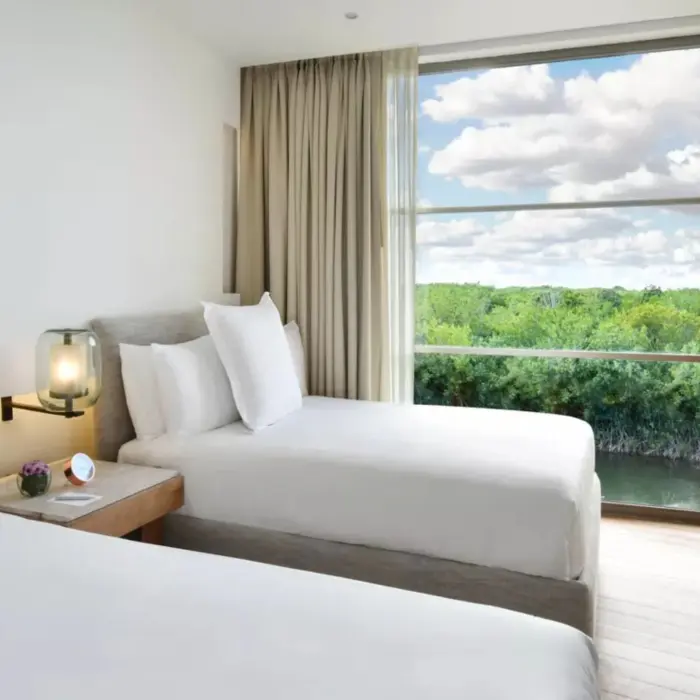 two bedroom suite with two beds at  Rosewood Mayakoba