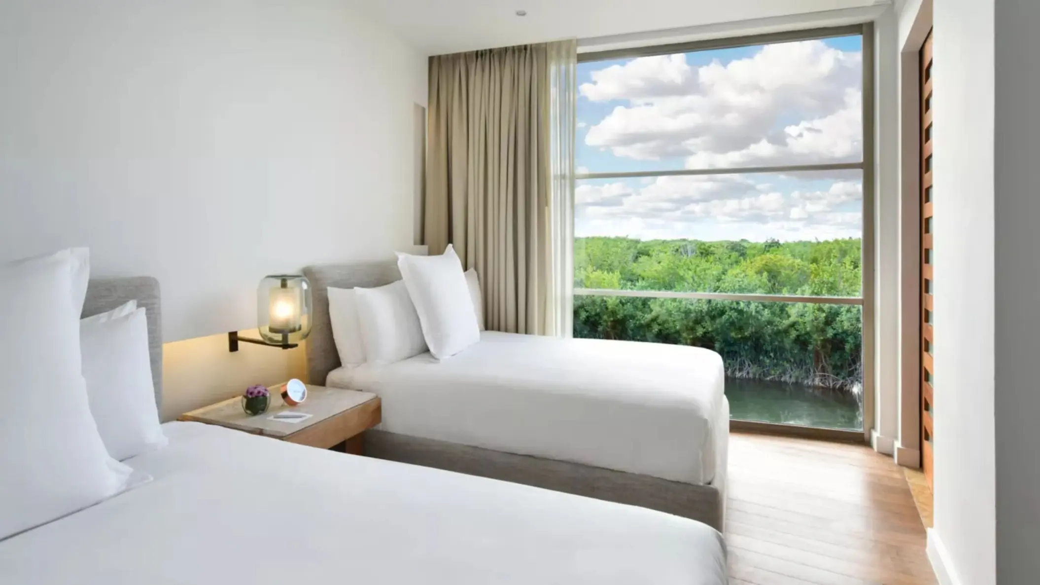 two bedroom suite with two beds at  Rosewood Mayakoba