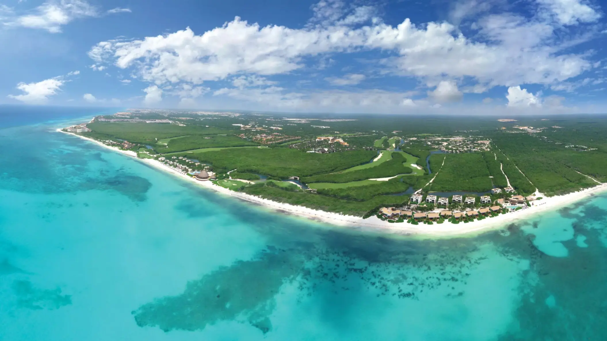 aerial view of the sea, the resort and the surrounding area of Rosewood Mayakoba