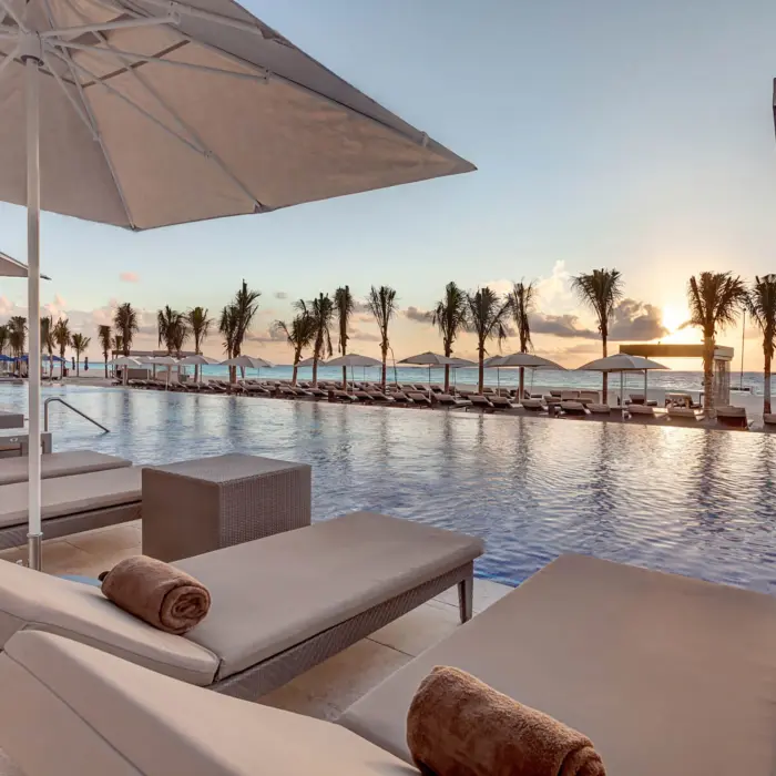 sunset over the pool at Royalton CHIC Cancun