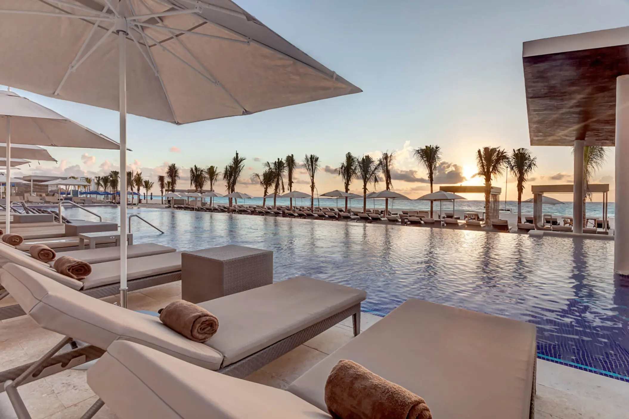sunset over the pool at Royalton CHIC Cancun