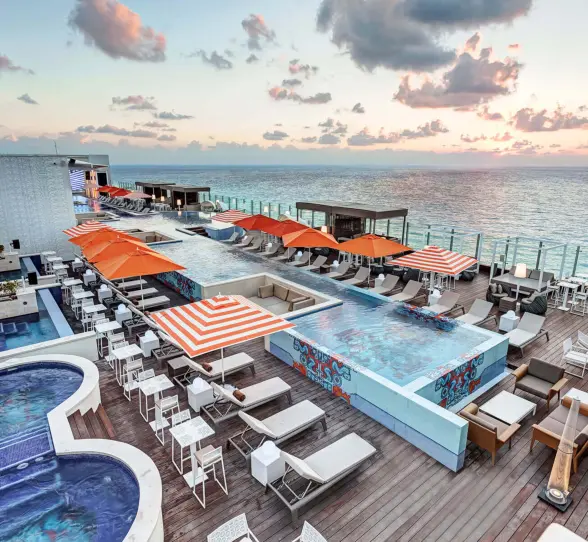 rooftop pool and hot tubs with ocean views at Royalton CHIC Cancun