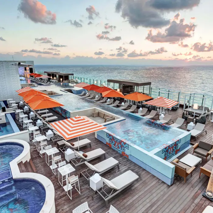 rooftop pool and hot tubs with ocean views at Royalton CHIC Cancun