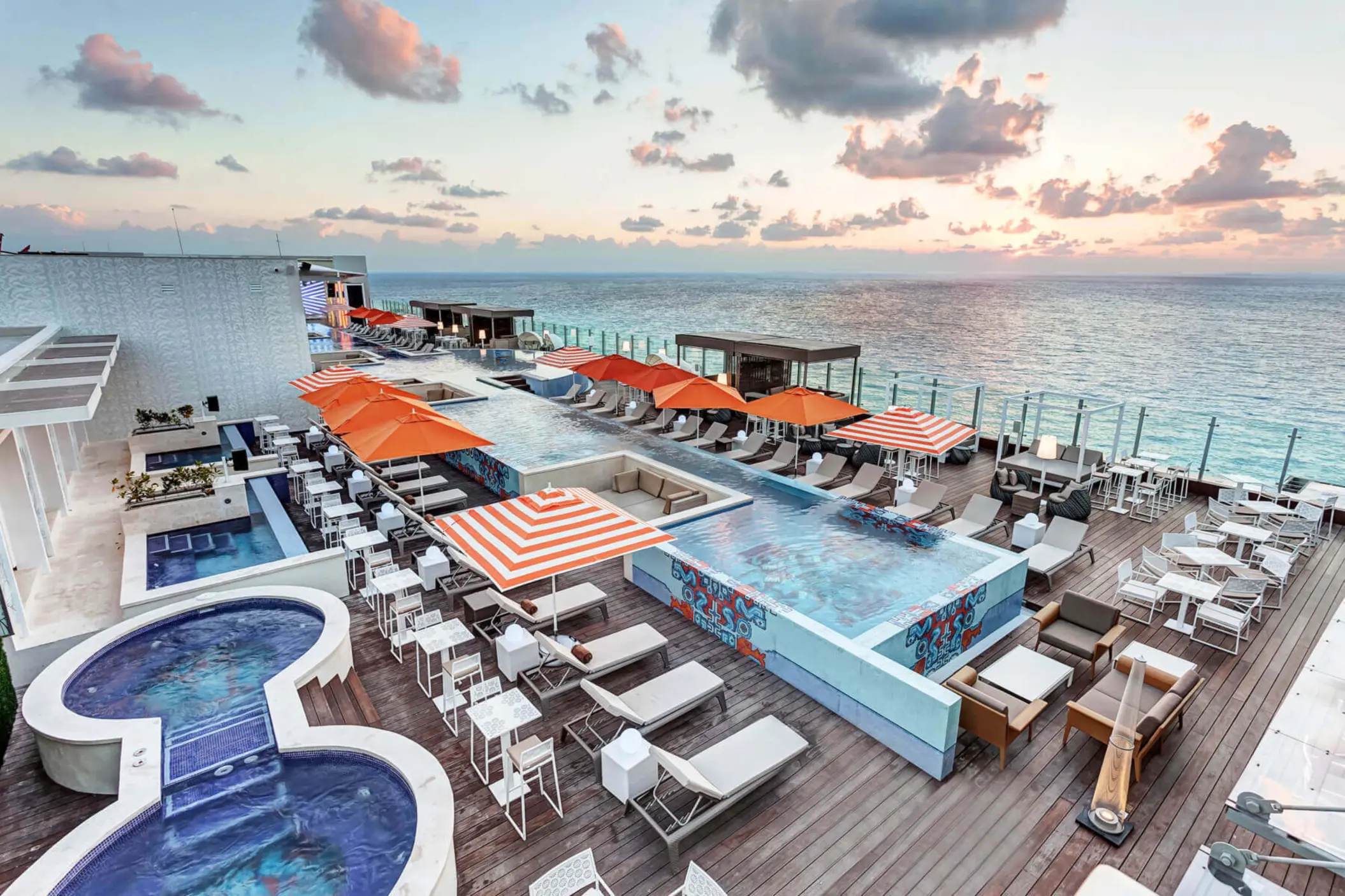 rooftop pool and hot tubs with ocean views at Royalton CHIC Cancun