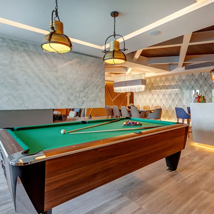 pool table and bar inside the chairman suite at Royalton CHIC Cancun