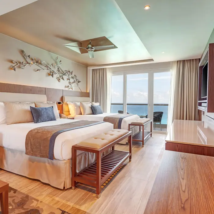 suite at Royalton CHIC Cancun with two beds and ocean views