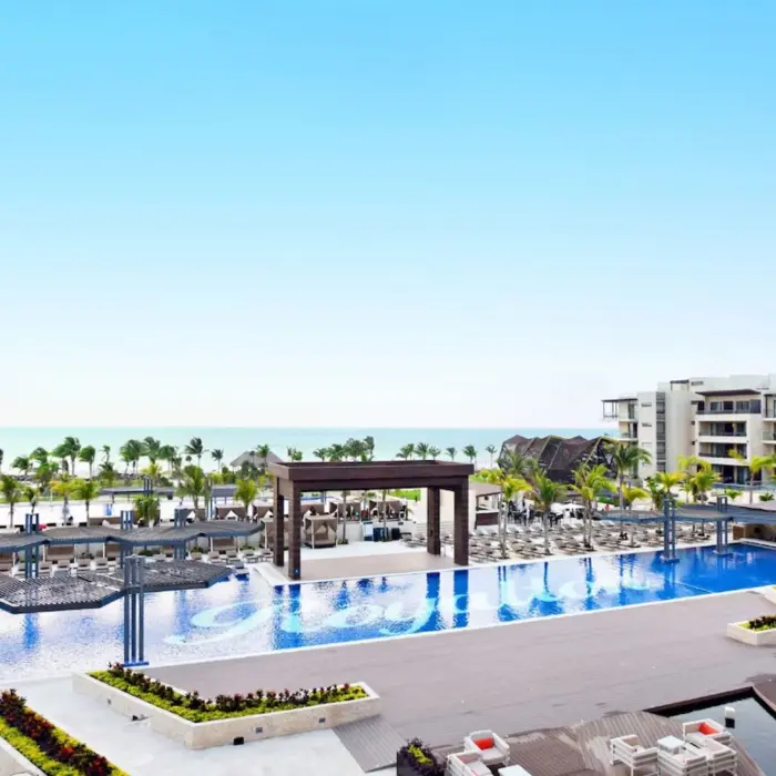aerial view of the pools and resort buildings at Royalton Riviera Cancun