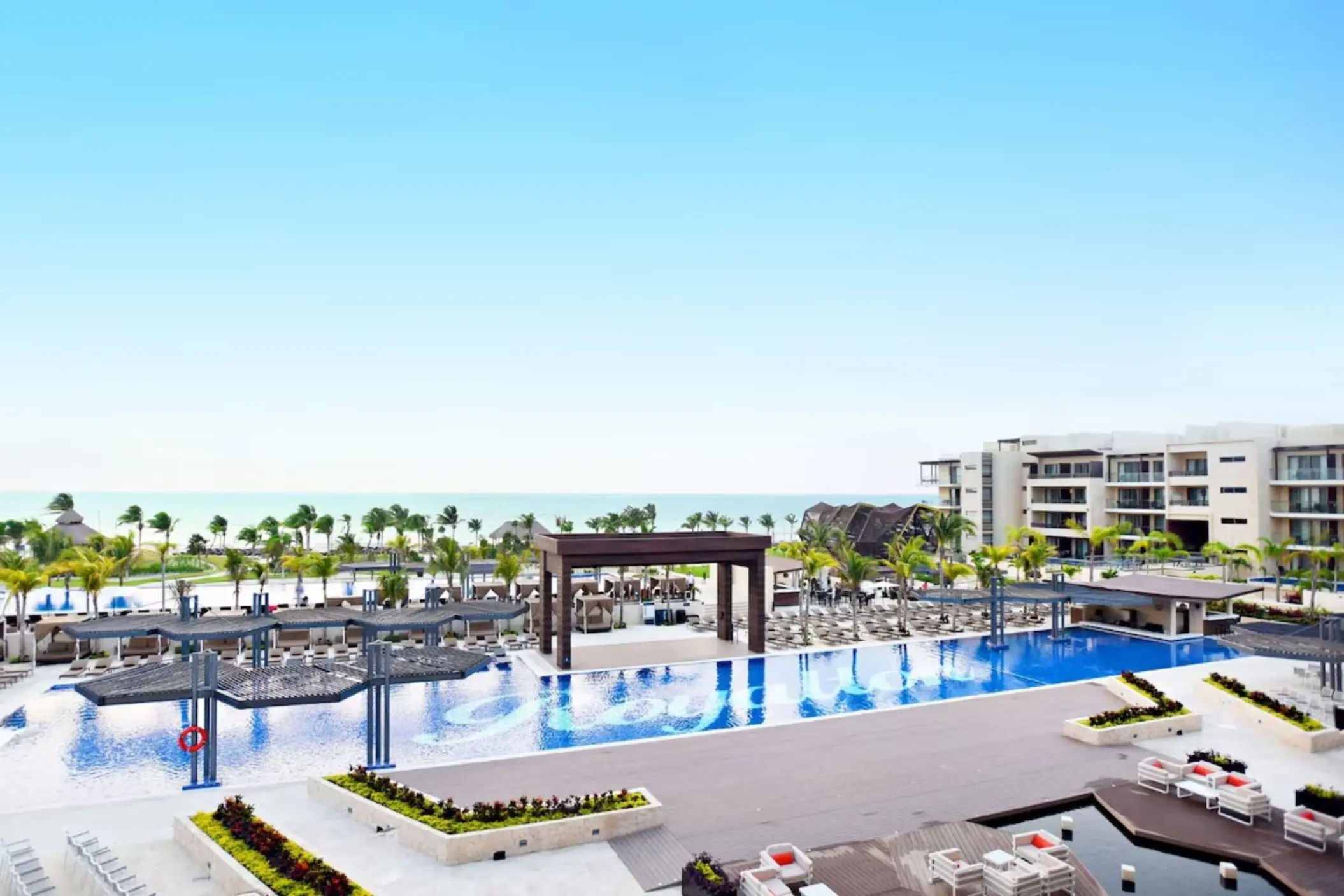 aerial view of the pools and resort buildings at Royalton Riviera Cancun