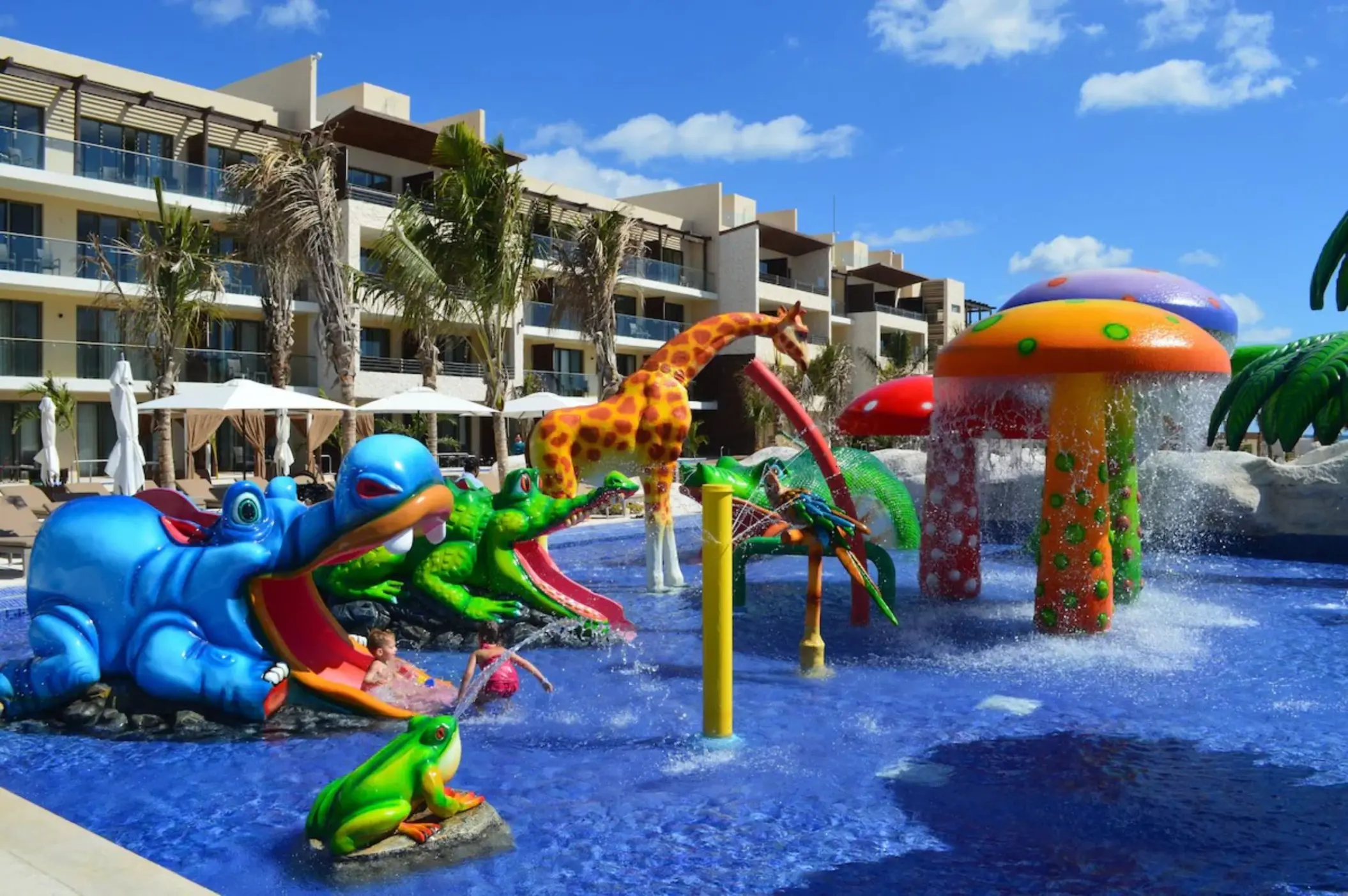 kids splash pool with slides and fun elements at Royalton Riviera Cancun