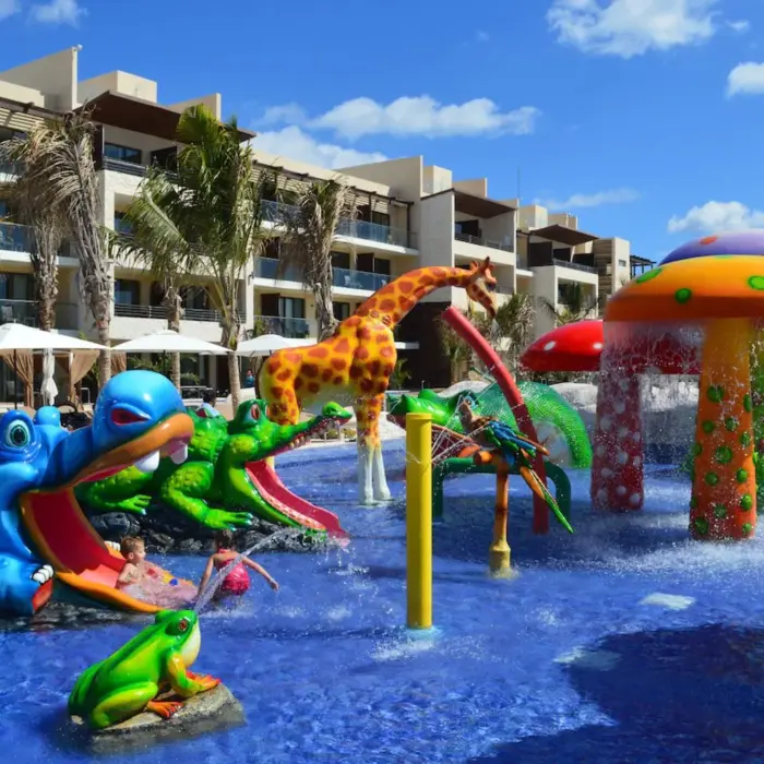 kids splash pool with slides and fun elements at Royalton Riviera Cancun