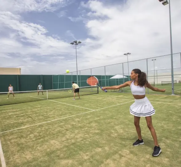 tennis court with people playing at Royalton Riviera Cancun