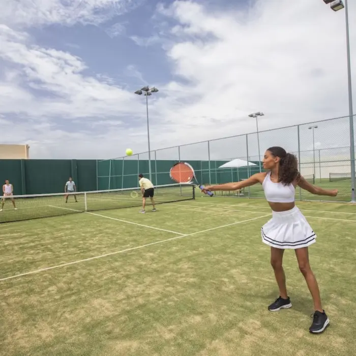 tennis court with people playing at Royalton Riviera Cancun