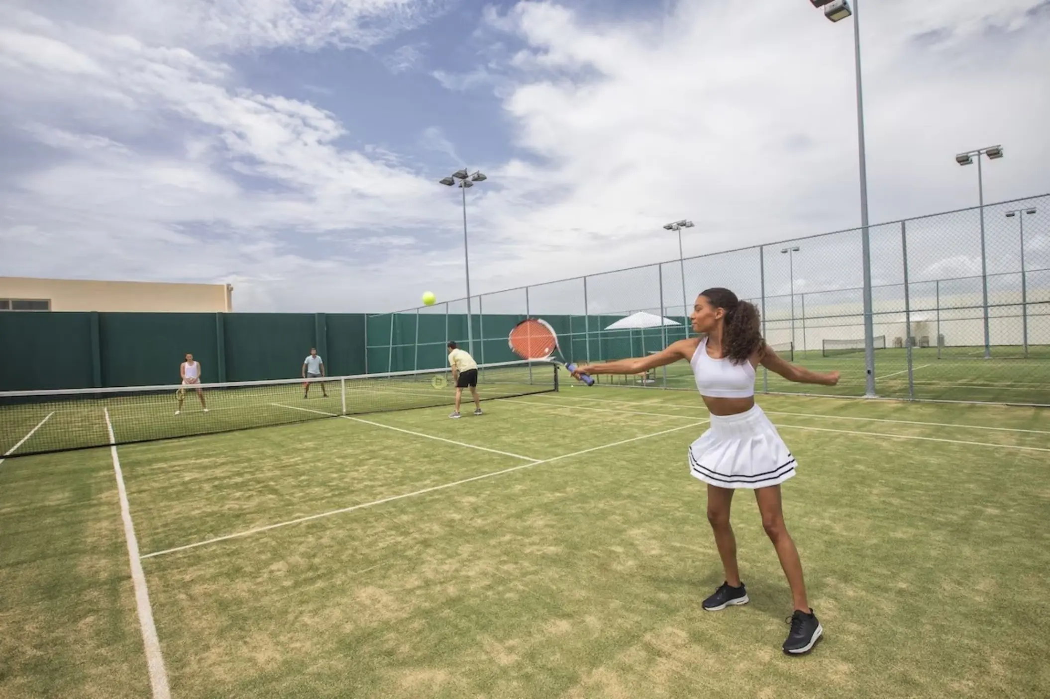 tennis court with people playing at Royalton Riviera Cancun