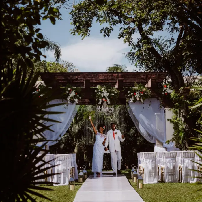 bride and groom at the garden venue at Sandos Playacar